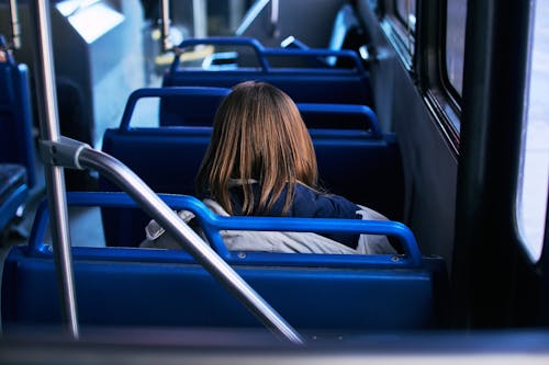 Woman Sitting Inside Bus