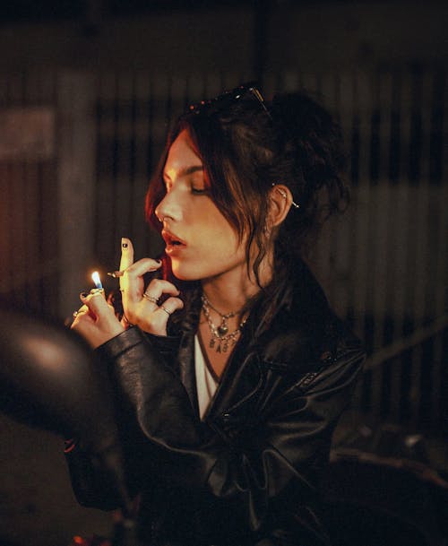 Free Woman in Black Leather Jacket Smoking Cigarette Stock Photo