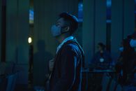 Man in Black Jacket Wearing Blue Headphones