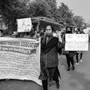 Grayscale Photo of People Protesting on the Street