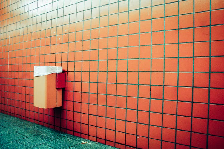 Brown Brick Wall With Green Floor Tiles