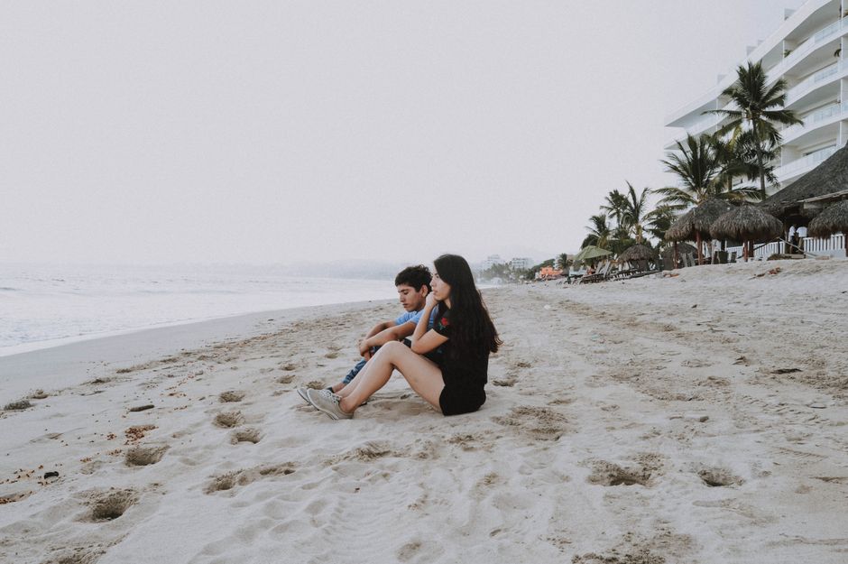 Two friends enjoying a calm day on Bucerías beach, Mexico.
