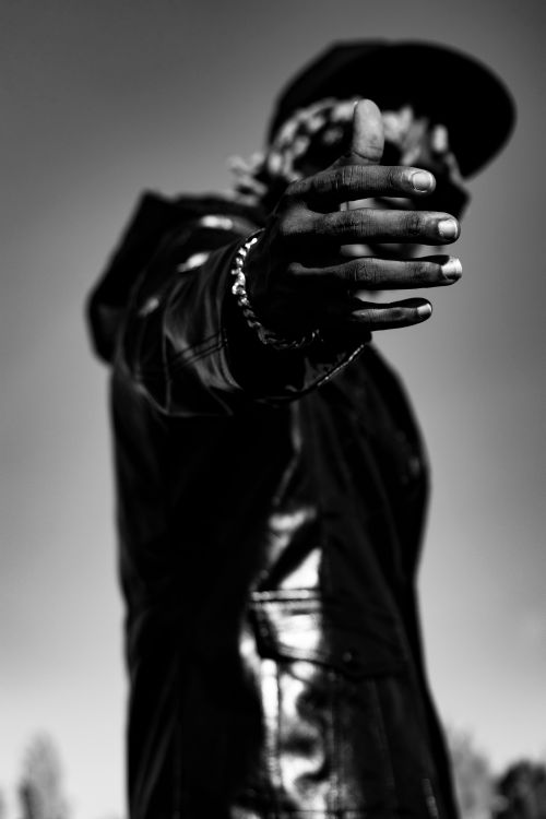 Free Black and white image of a person reaching out their hand, focusing on the gesture. Stock Photo