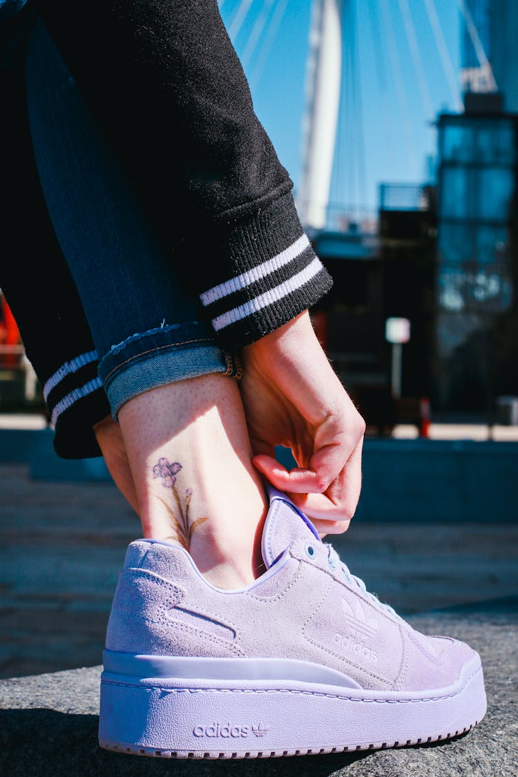 A Person Wearing Purple Sneakers