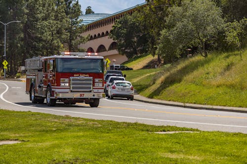 Free Red and White Fire Truck on Road Stock Photo