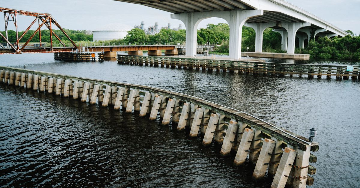 Elegant bridge spanning over a serene river in Sanford, FL, highlighting stunning architectural details.