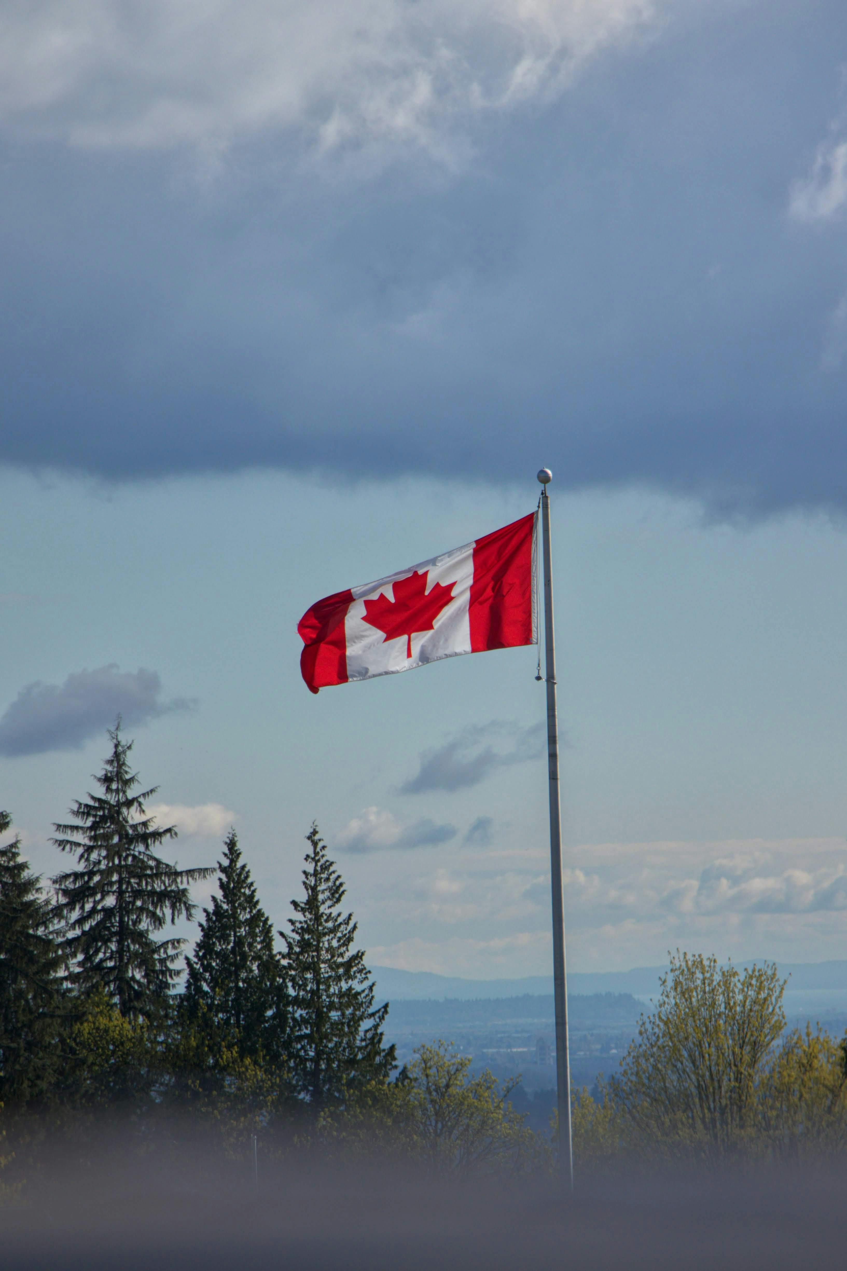 Canada Flag on the Flagpole · Free Stock Photo