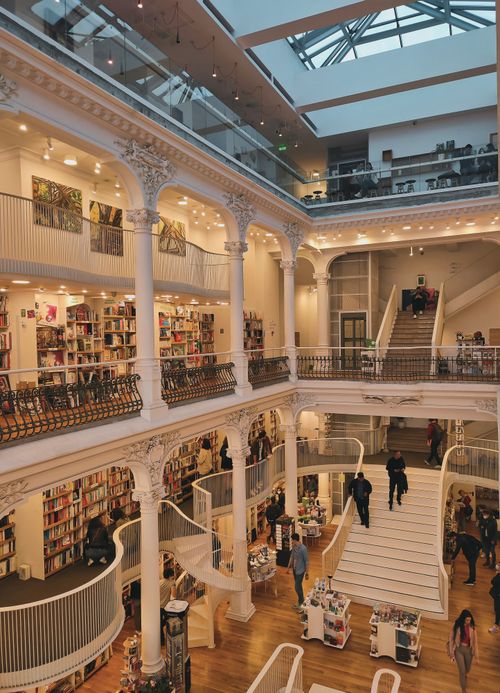 Free A luxurious multi-story bookstore with classic architecture and vibrant shopping atmosphere. Stock Photo
