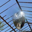 Silver Ball Hanging on Brown Metal Frame