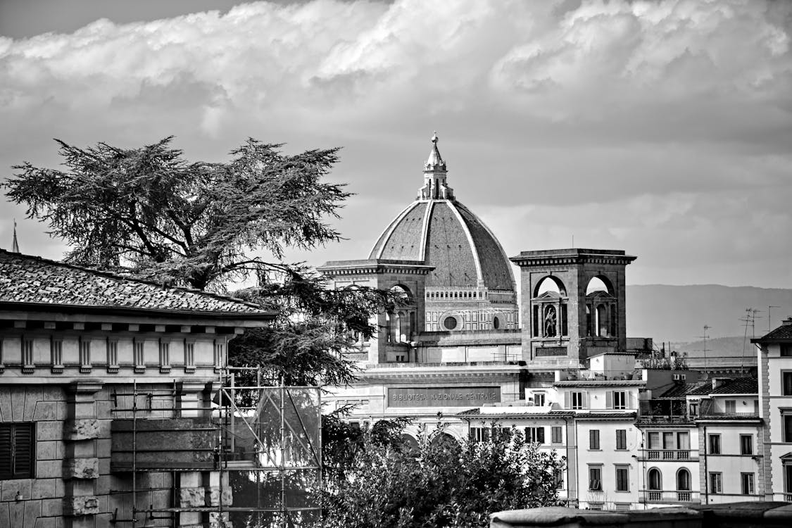 A Grayscale Photo of a Historical Landmark Under the White Clouds