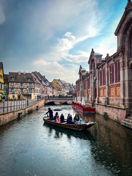 People Riding a Boat Traversing a River Canal