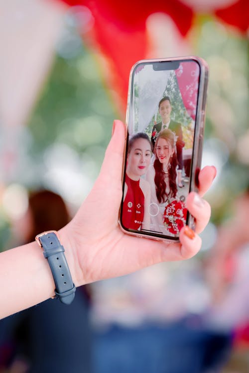 A Person Holding a Smartphone while Taking Selfie