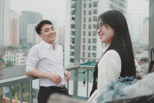 Smiling Couple on a Balcony 