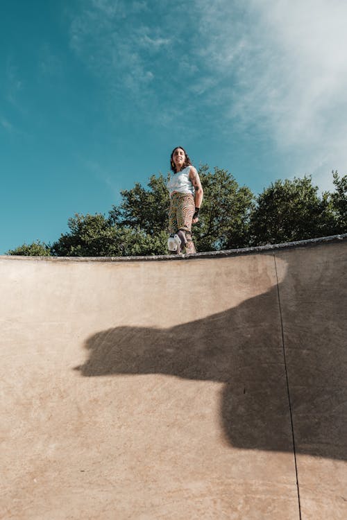 Woman Standing on Top of a Ramp