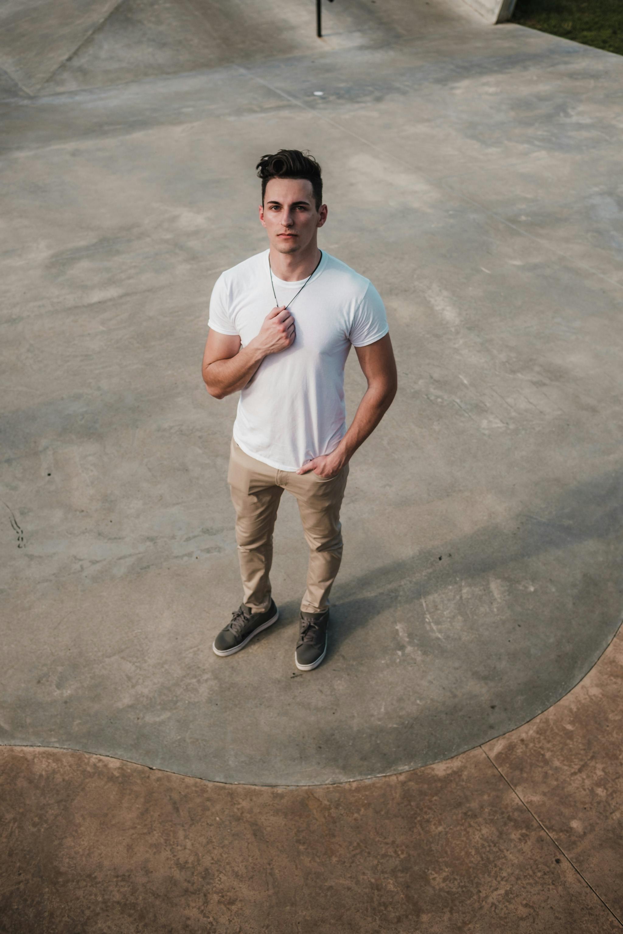 Man in White Shirt and Khaki Pants · Free Stock Photo