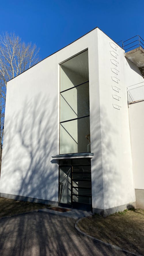 White Concrete Building Under the Blue Sky