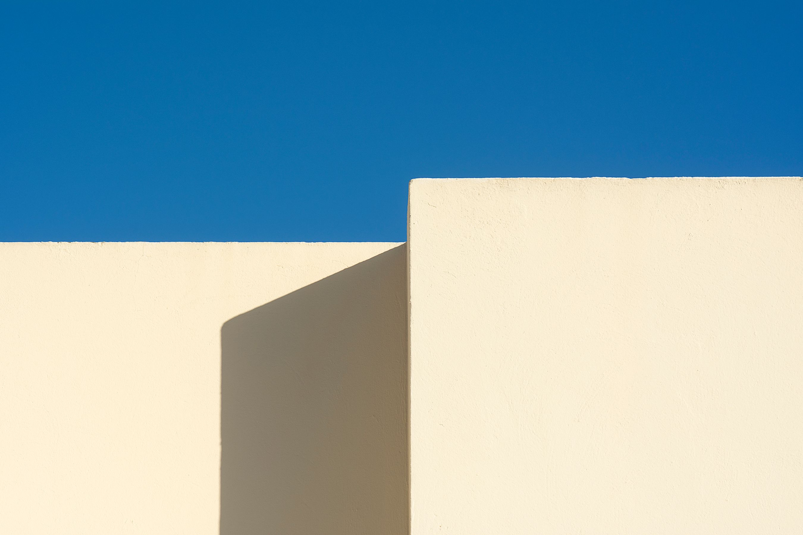 Minimalist architecture against a clear sky