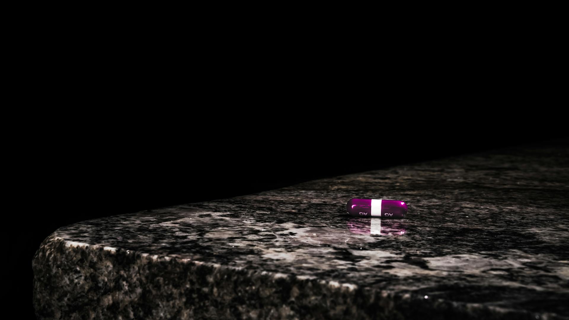 Purple Medication Tablet on Table