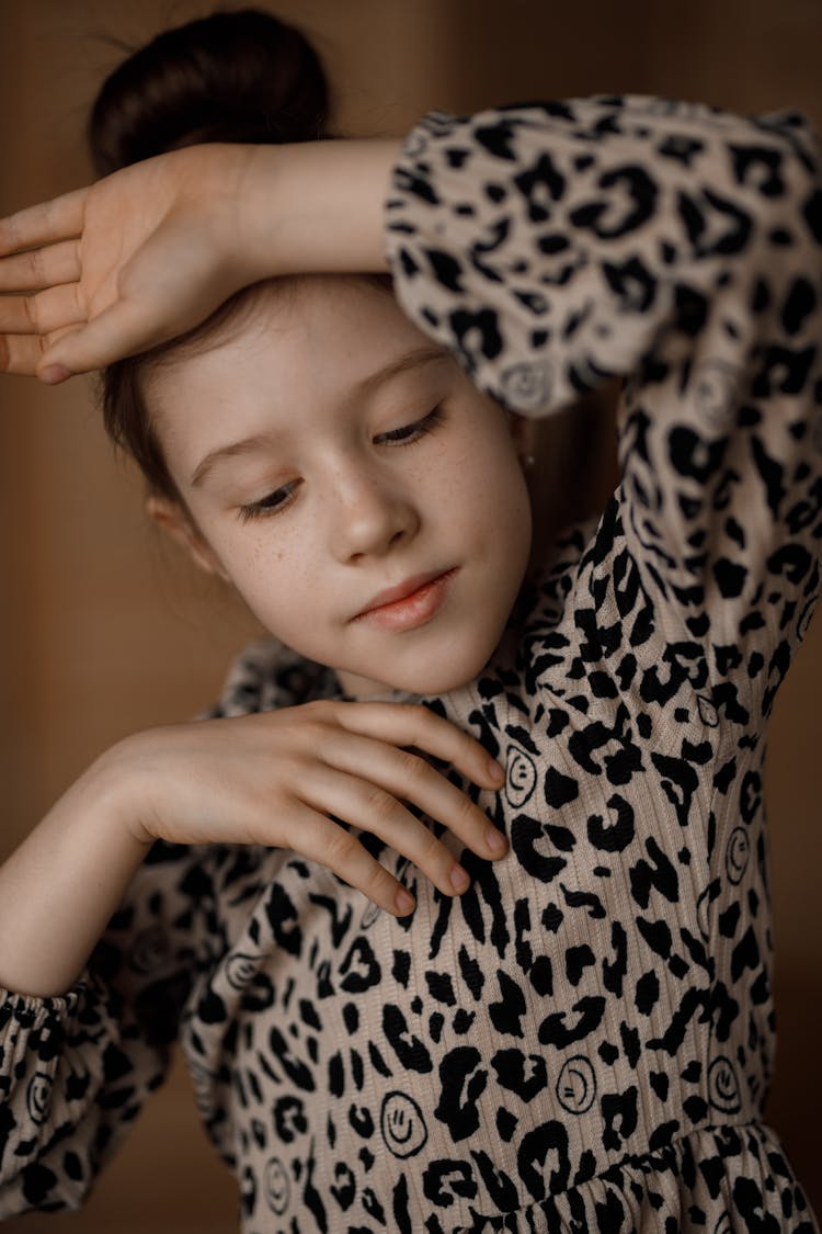 Girl Posing In A Cheetah Print Dress