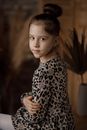 Girl Posing in a Cheetah Print Dress