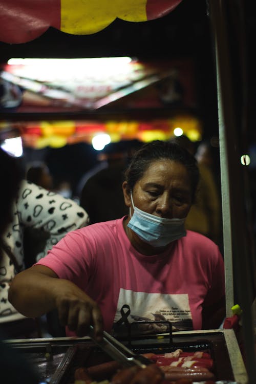 Person in Crew Neck Shirt Wearing a Face Mask