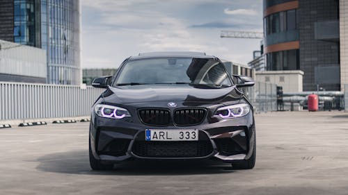 A Black Coupe Car on the Road