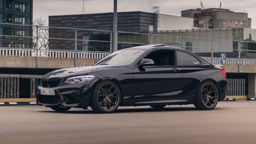 A Black Coupe Car on the Road