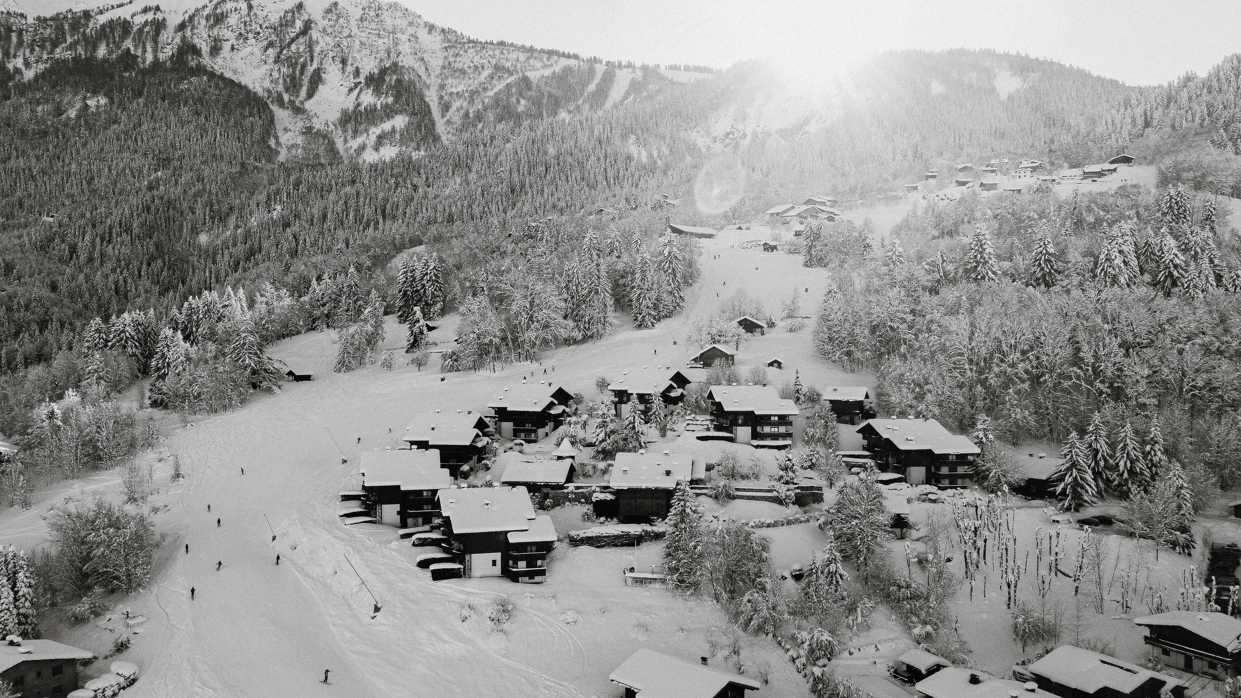 Prescription Goggle Inserts - Aerial view of snow-covered Les Houches in winter, showcasing serene mountainous landscapes.