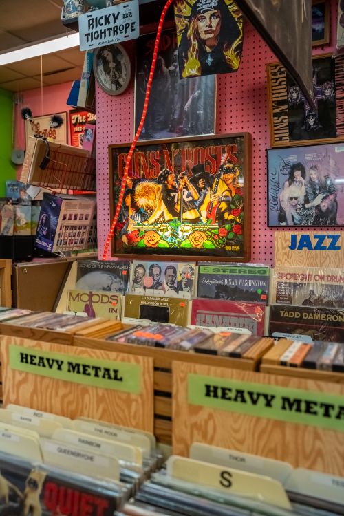Free Discover classic rock and heavy metal vinyl records at a retro Orlando store. Stock Photo