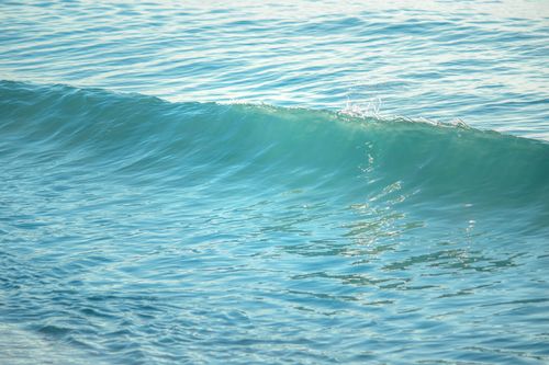 Free Tranquil ocean wave at Mahahual beach, perfect for serene and calming vibes. Stock Photo