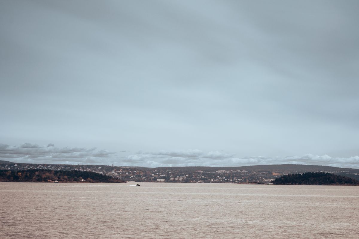 Serene view of the Oslofjord with calm waters under an overcast sky