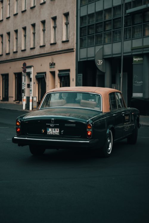 Free Retro vehicle cruising a city street offers timeless design charm. Stock Photo
