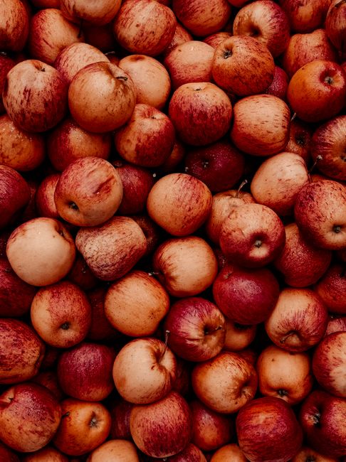 A vibrant close-up of fresh red apples showcasing their natural texture and color.