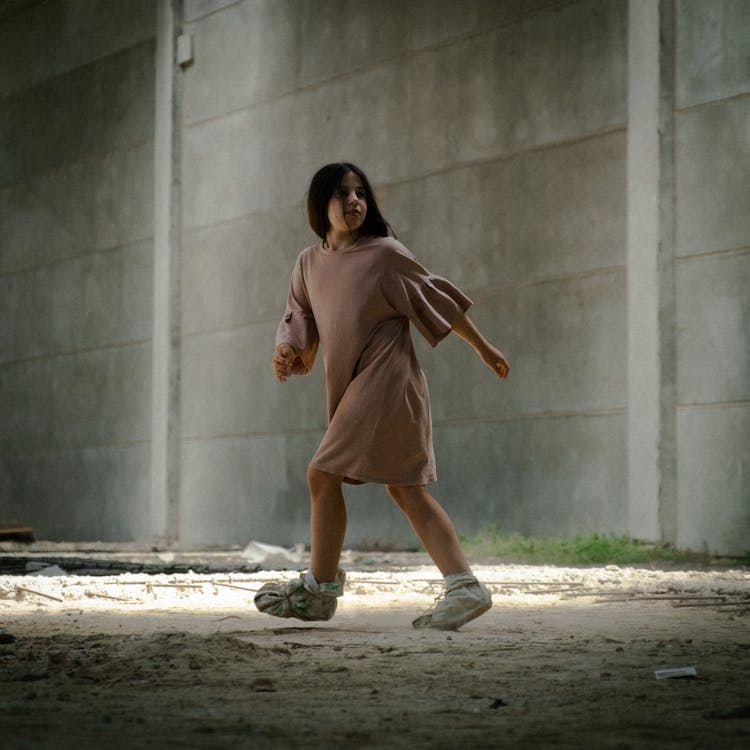 Kid Walking Inside An Abandoned Building