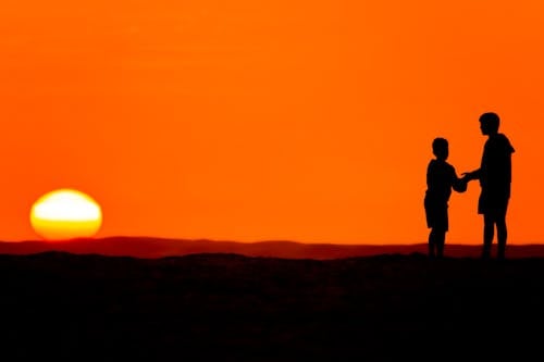 Man and Kid Standing Together