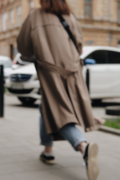 Free Woman in Brown Coat and Black Boots Walking on Sidewalk Stock Photo