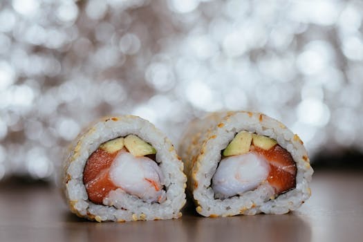 Delicious sushi rolls featuring salmon, avocado, and nori on a textured background.