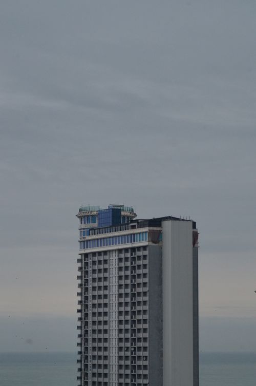 Free Tall skyscraper stands against an overcast sky, modern architecture. Stock Photo