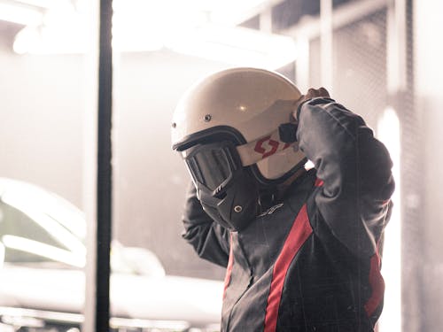 A Man in Black Jacket Wearing White Helmet