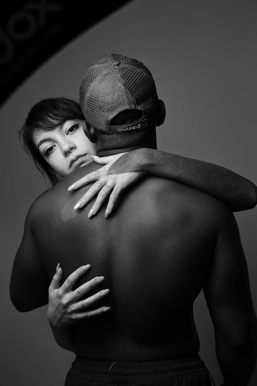 A Woman Hugging Her Partner