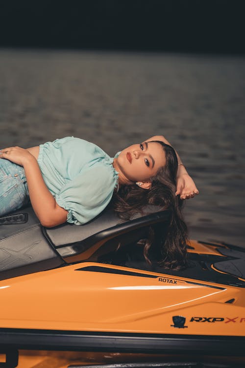 Portrait Of a Woman Lying On the Motorboat