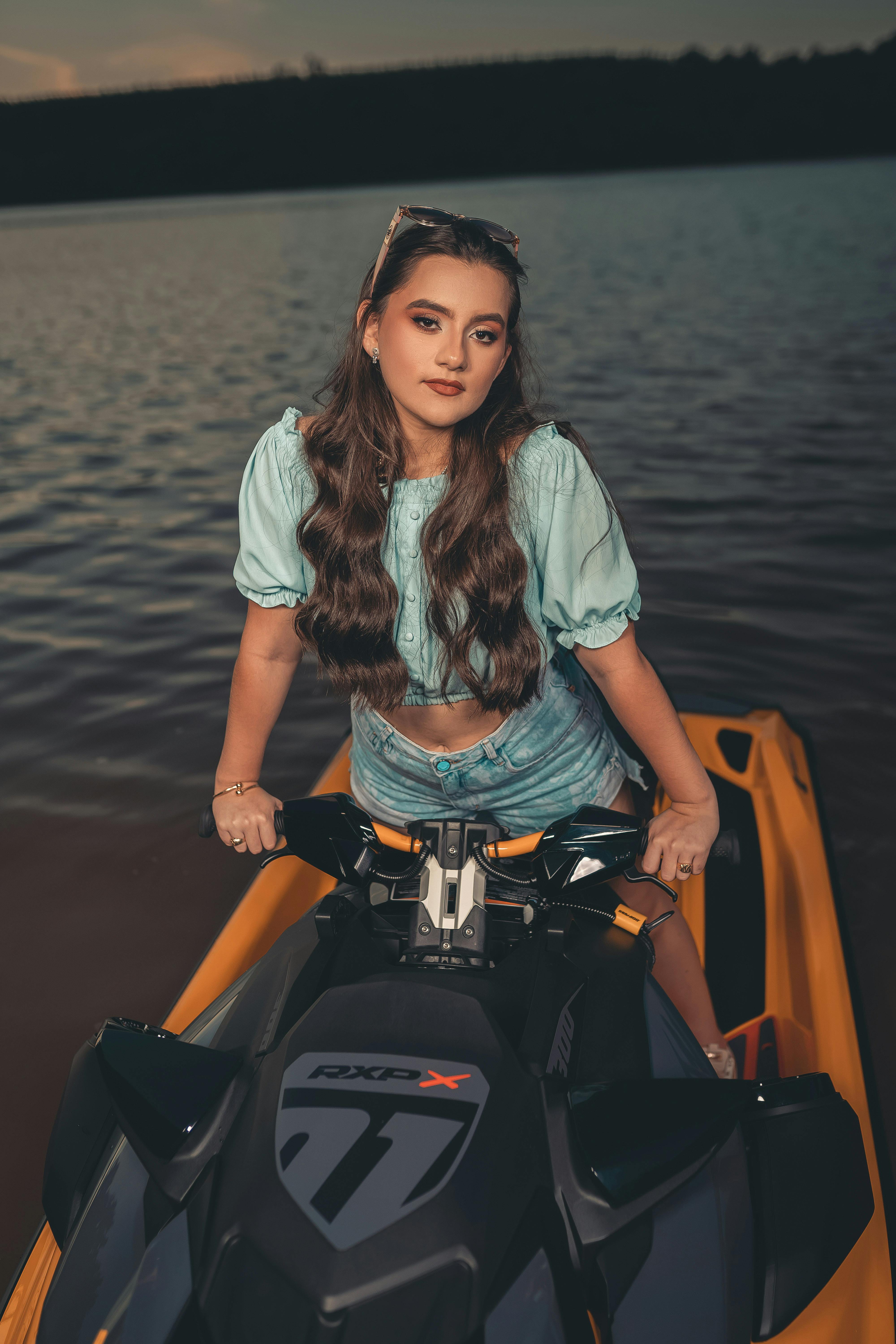 Prescription Goggle Inserts - Sunset ride on a jet ski with a fashionable young woman at a serene lake.