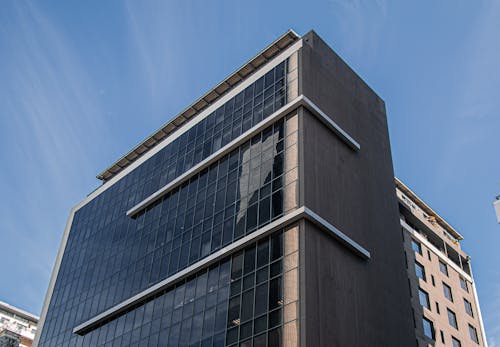 A Low Angle Shot of a Building Under the Blue Sky