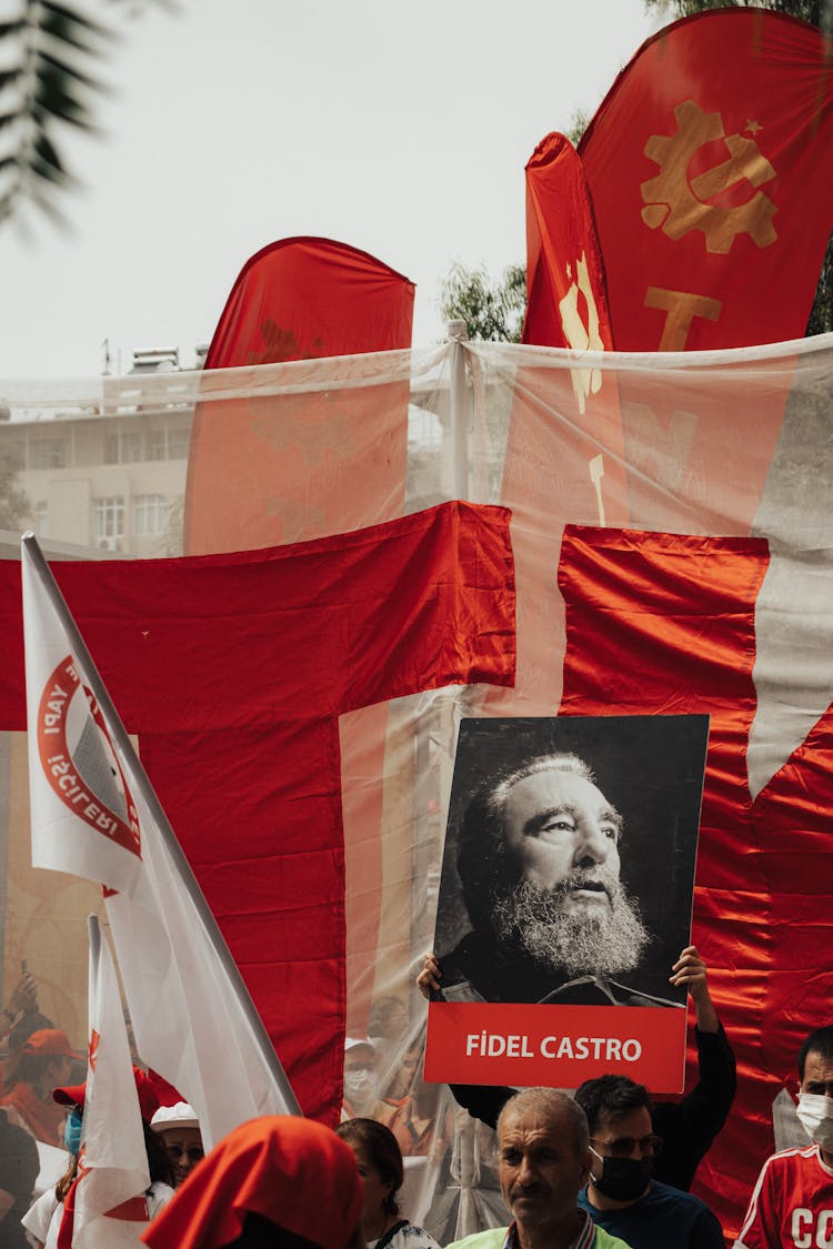 Person Holding Banner With Fidel Castro At Rally