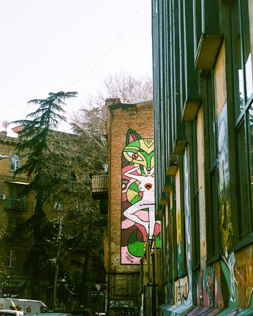 Brown Concrete Building With Graffiti