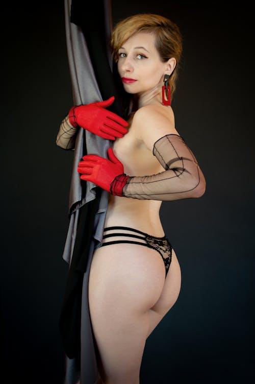 Woman in Black Underwear and Red Gloves