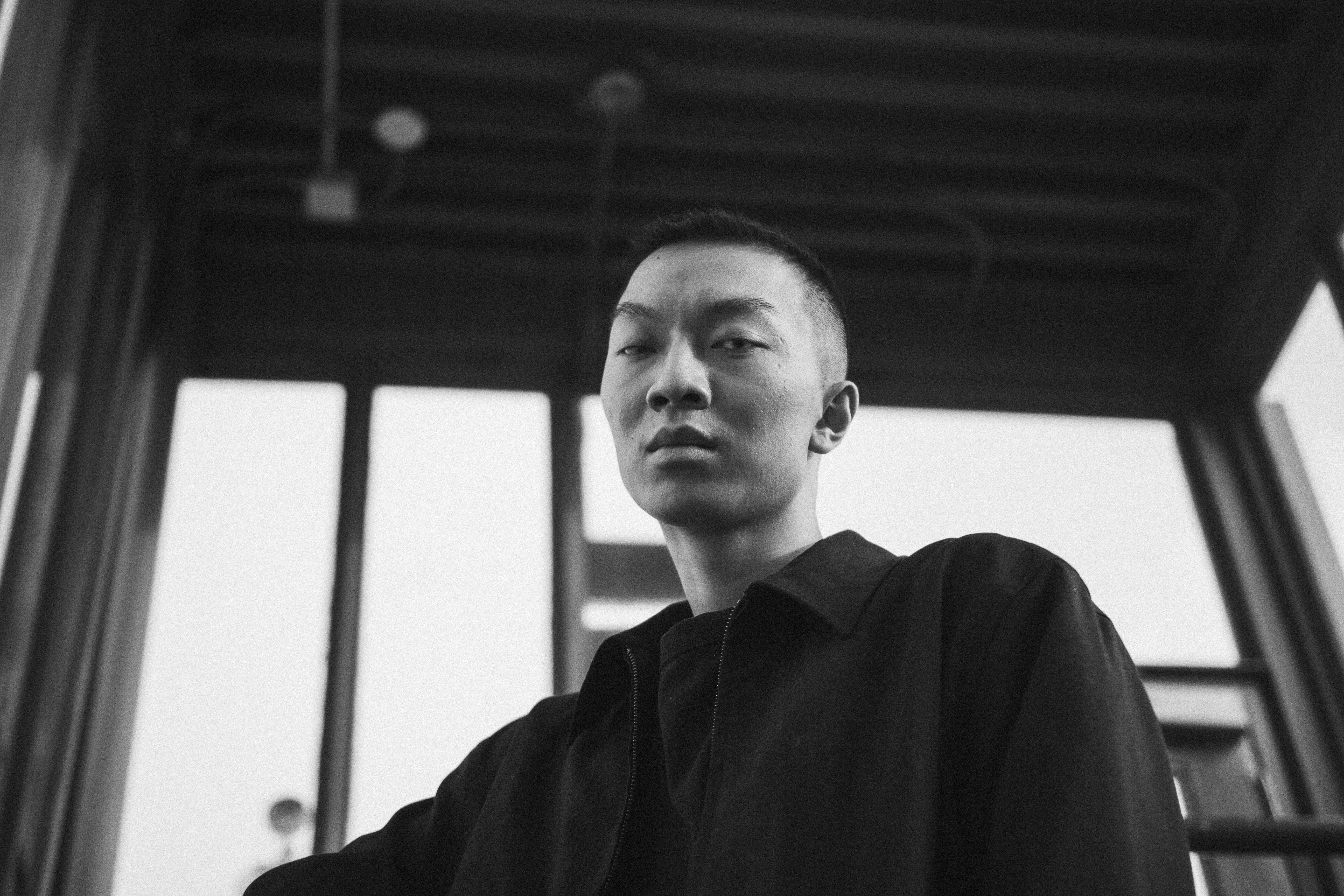 Black and White Portrait of Man Looking Down · Free Stock Photo