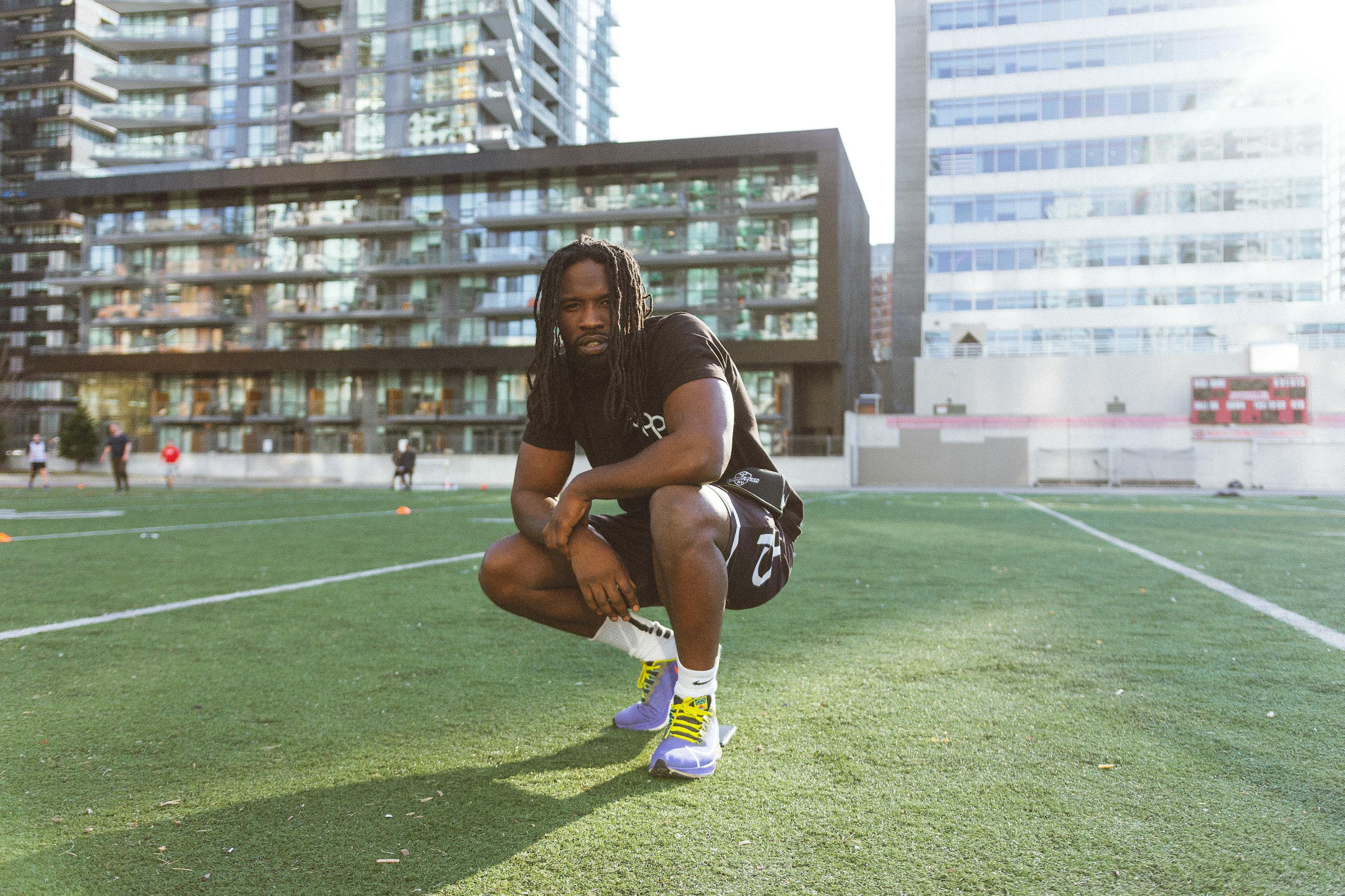 Athlete crouching on an urban sports ground