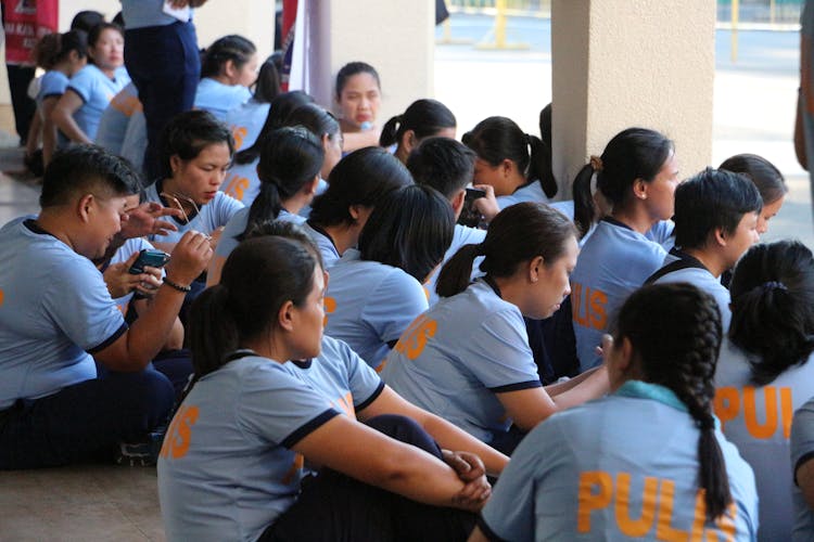 Group Of Police Women Sitting On The Floor