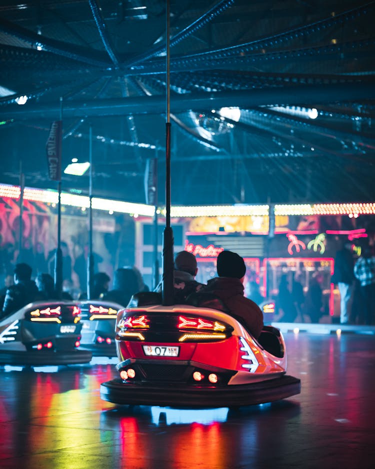 People Riding Bumper Cars